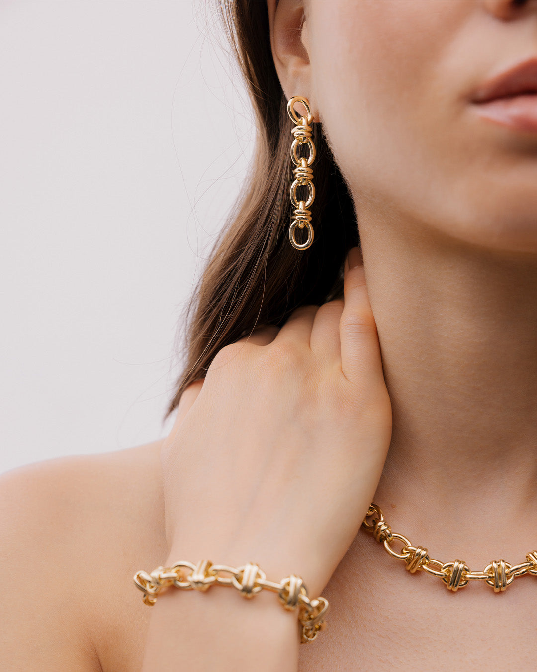 Aretes Eslabones Cruzados