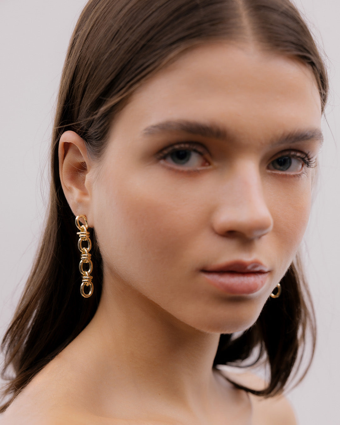 Aretes Eslabones Cruzados